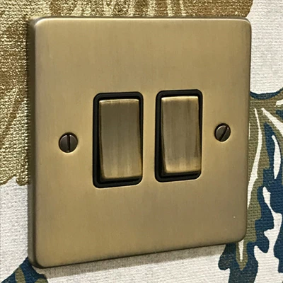 Low Profile Rounded Antique Brass Intermediate Switch and Light Switch Combination