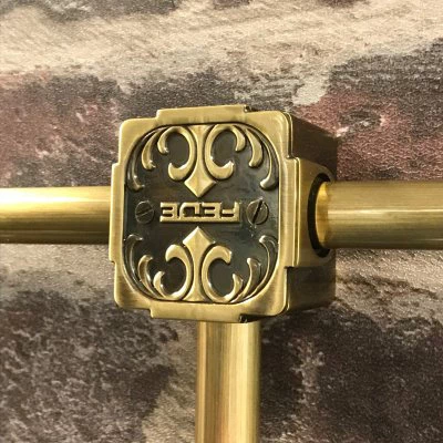 Surface System Ornate Antique Brass Conduit Connector