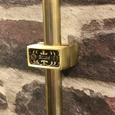 Surface System Ornate Antique Brass Conduit Holder