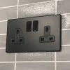Contemporary Screwless Black Switched Plug Socket - 1